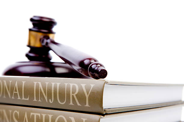 Personal injury lawbook with gavel.